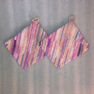 Pinks, purples, and blues crochet cotton pair of potholders